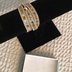 Adjustable wrap bracelet gold tone and silver.